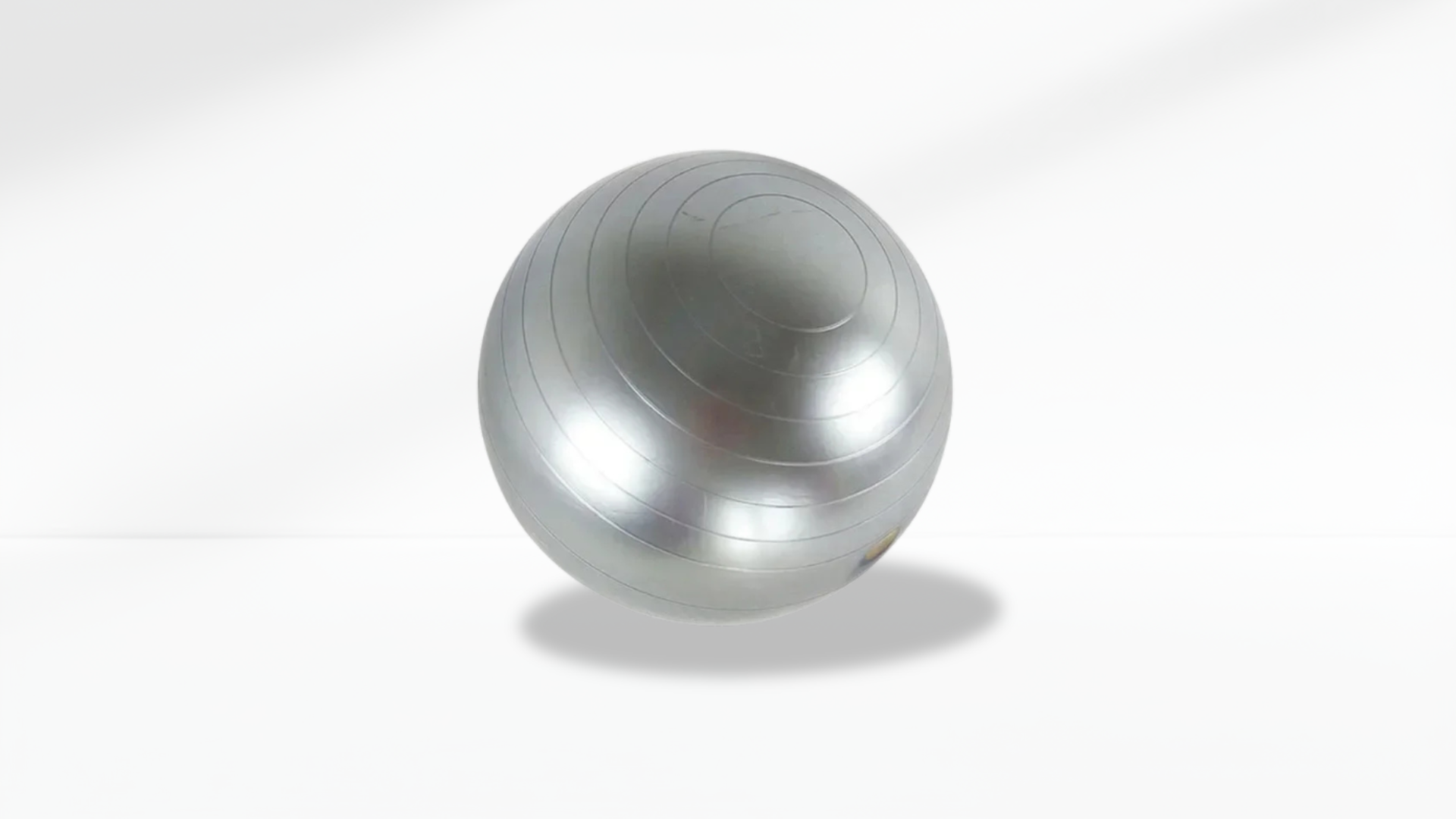 Silver exercise ball on a white background