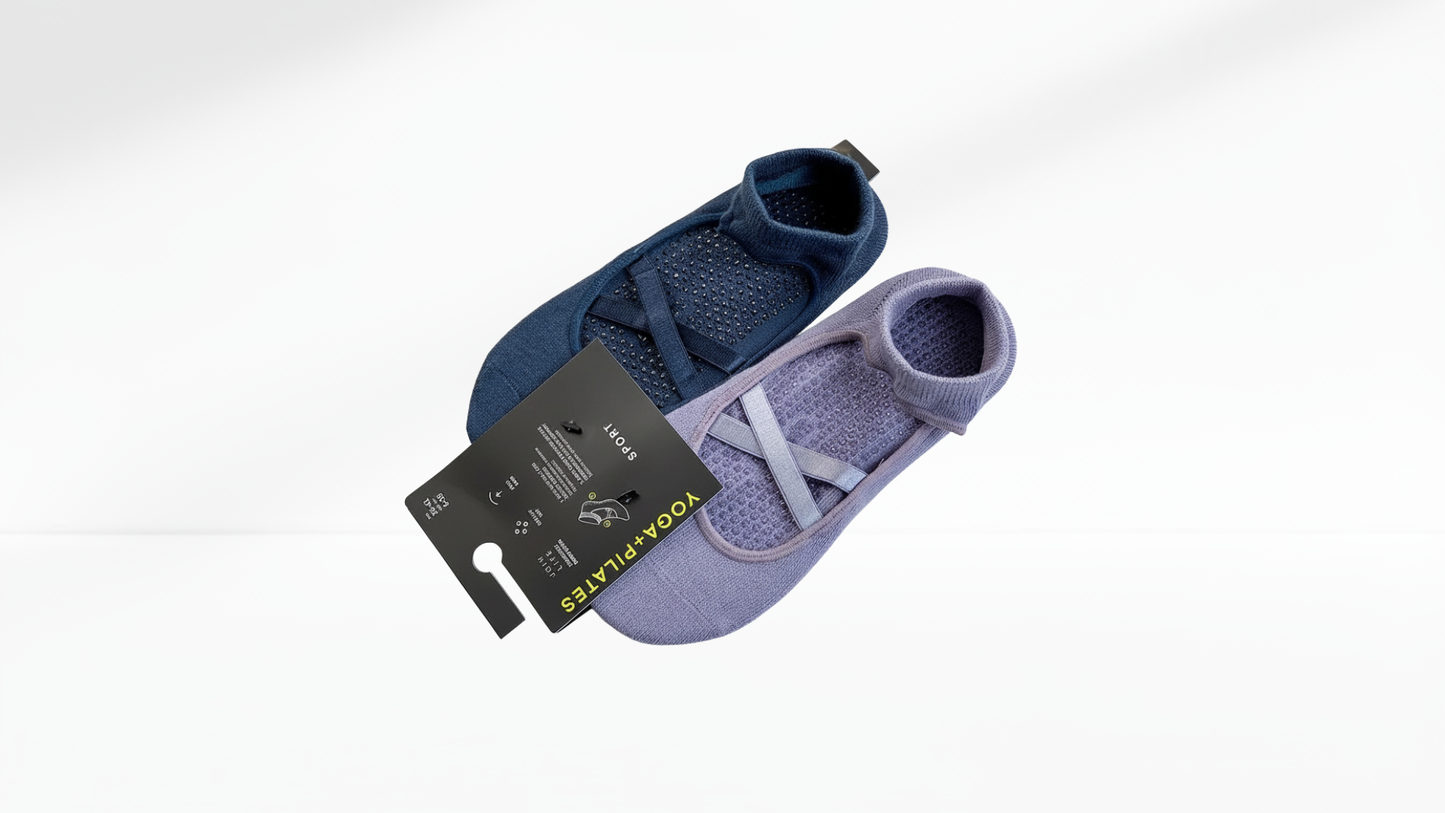 Two pairs of Grip Socks – Ballet Mary Jane, one blue and one purple, with a label on a white background.