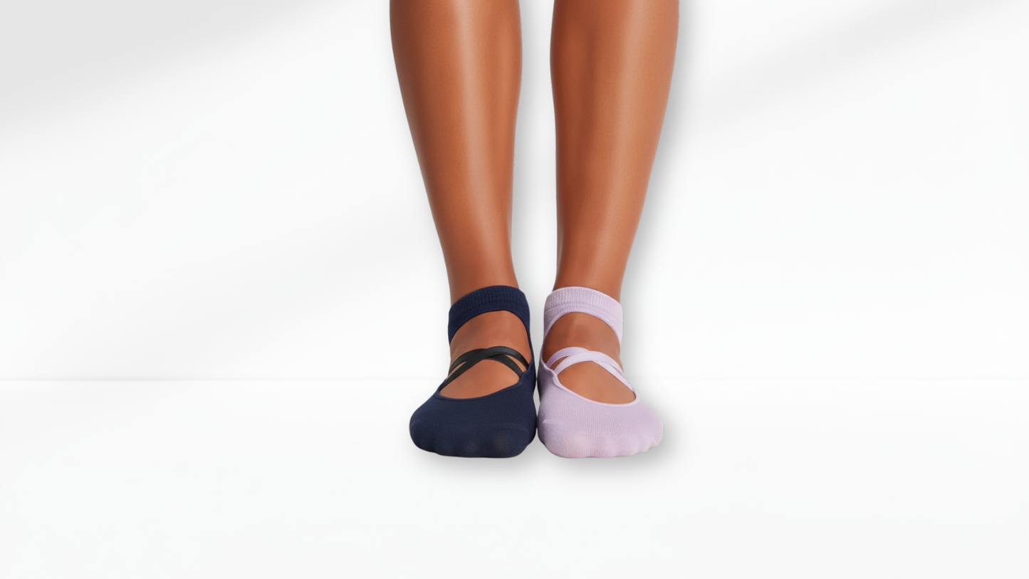 Two pairs of Grip Socks – Ballet Mary Jane, one navy and one pink, on a white background.