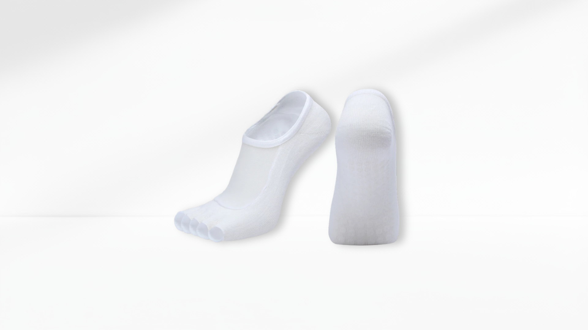 Two white Toe Socks Mesh Grip on a light gray background