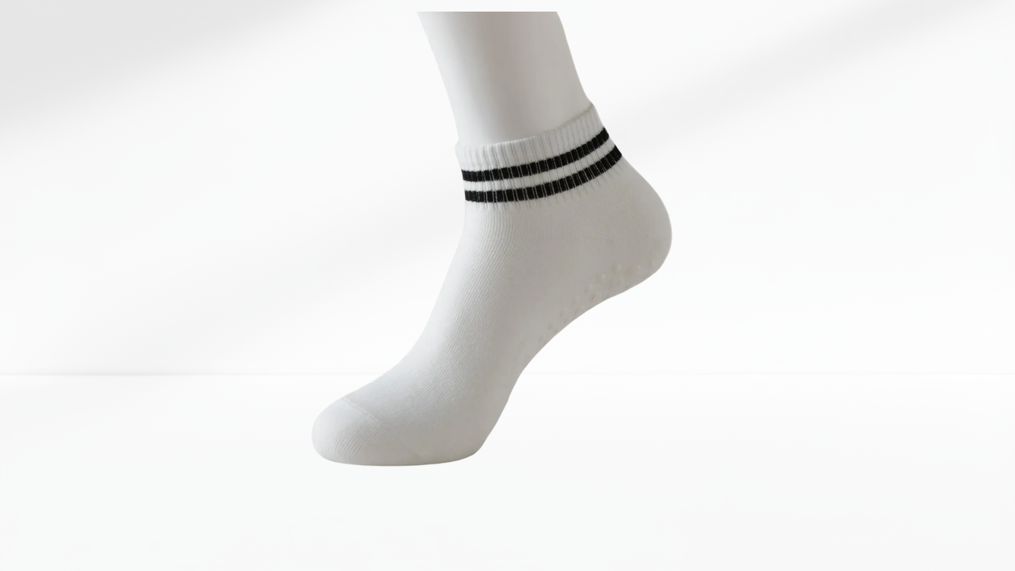 White grip sock with black stripes on a white background
