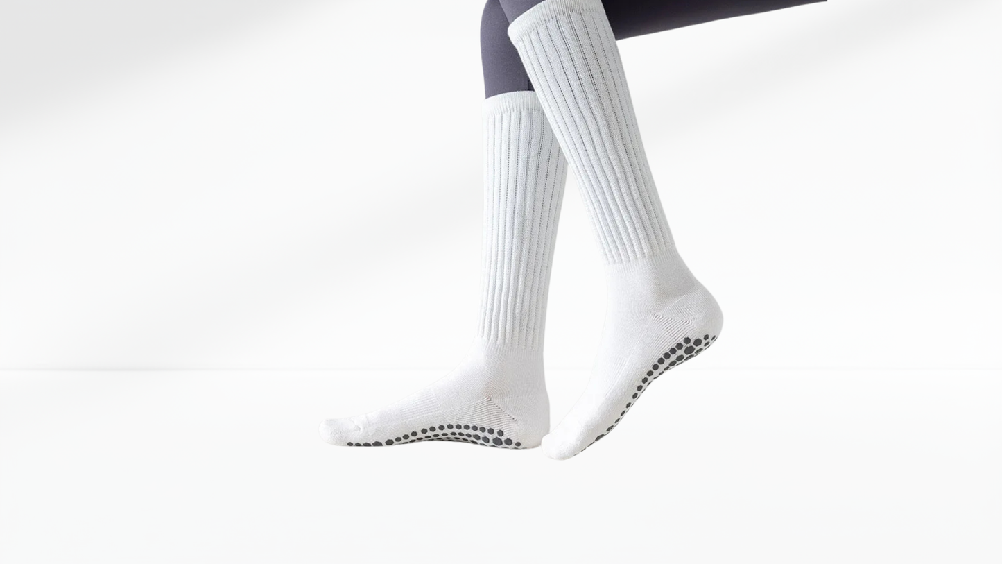 White grip socks with black sole on a white background