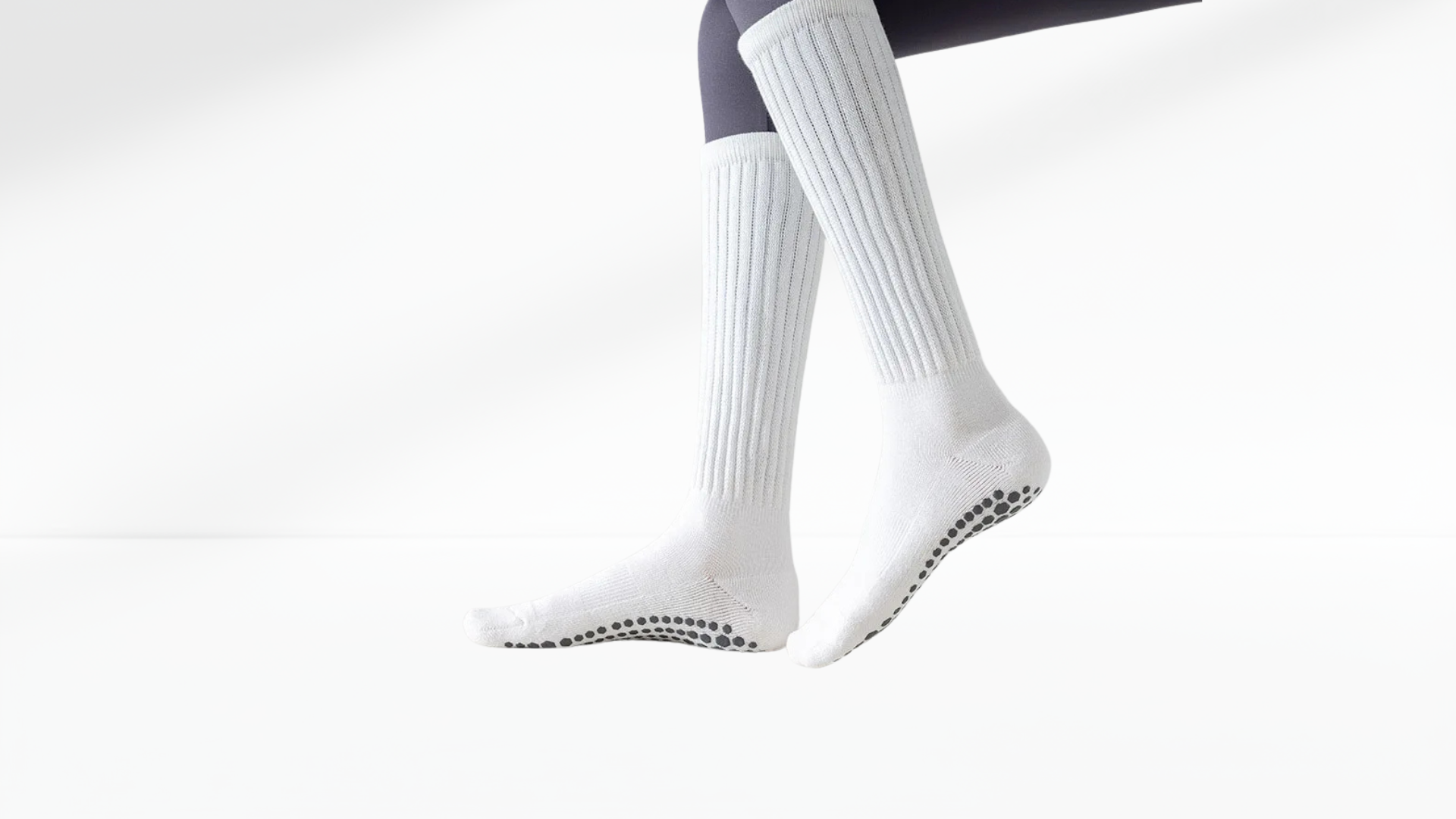 White grip socks with black sole on a white background