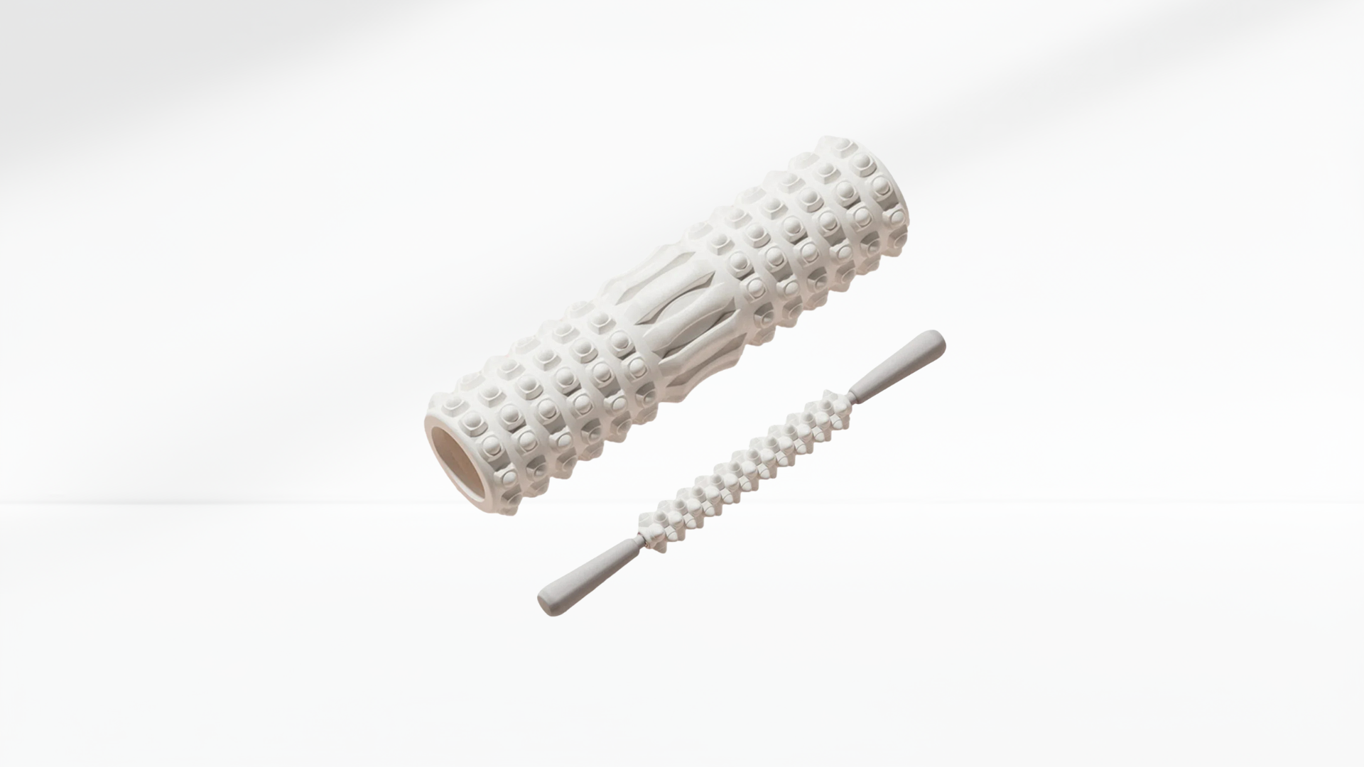 White textured roller with stick on a white background