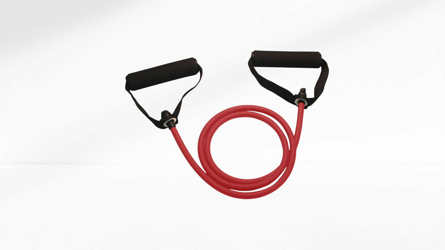 Woman exercising with red resistance bands on a white background