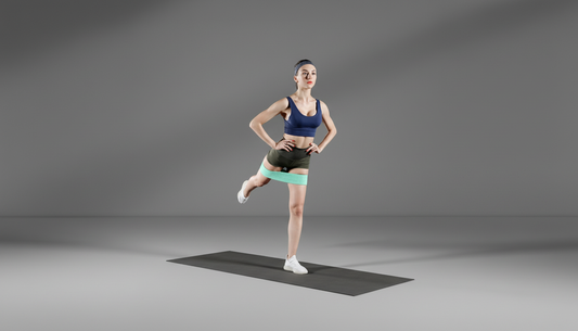 Woman performing a yoga pose with green resistance bands on a gray background