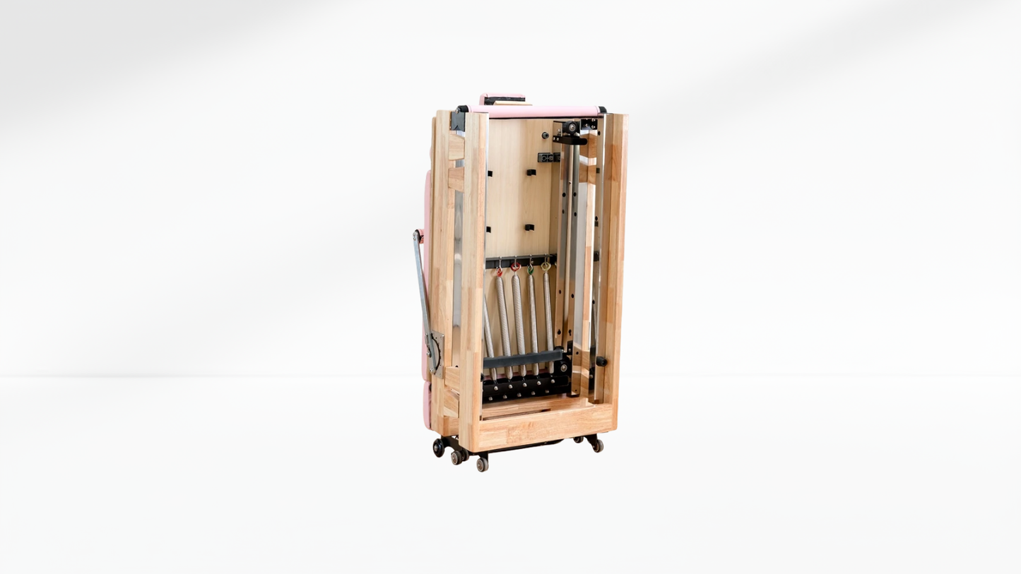 Wooden pilates reformer with wheels on a white background