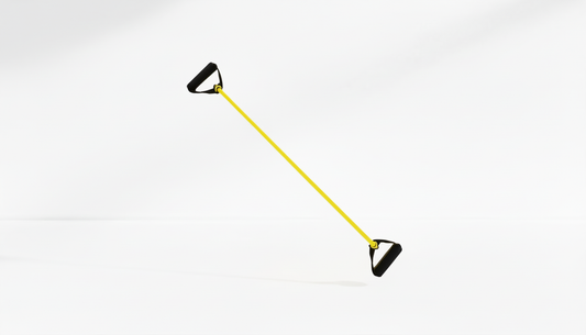Yellow resistance band with black handles on a white-grey background