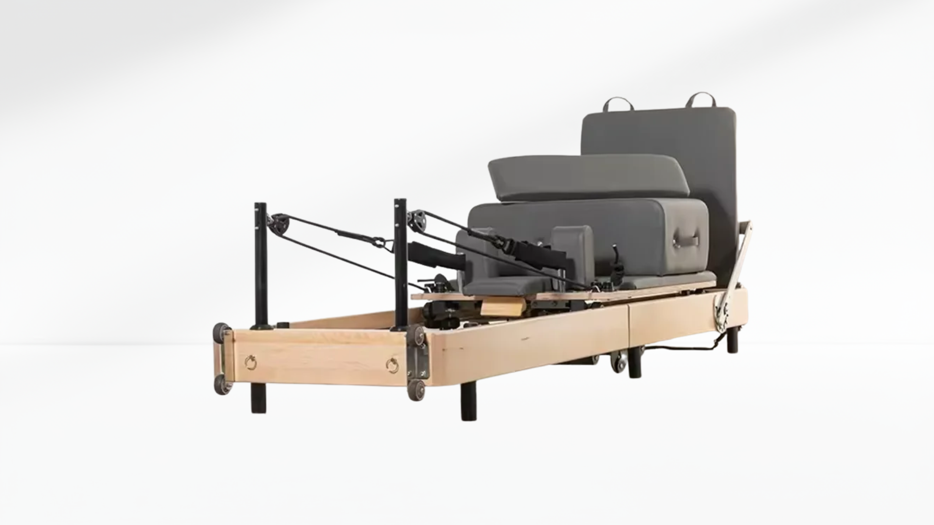 beige Pilates Reformer – Rebounder & 6-Level Resistance machine with box on a white background