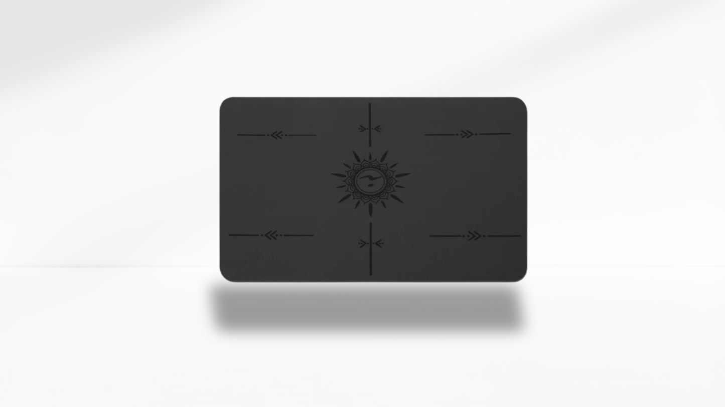 Front view of a black mini flat support yoga mat with alignment markers on a clean white background.
