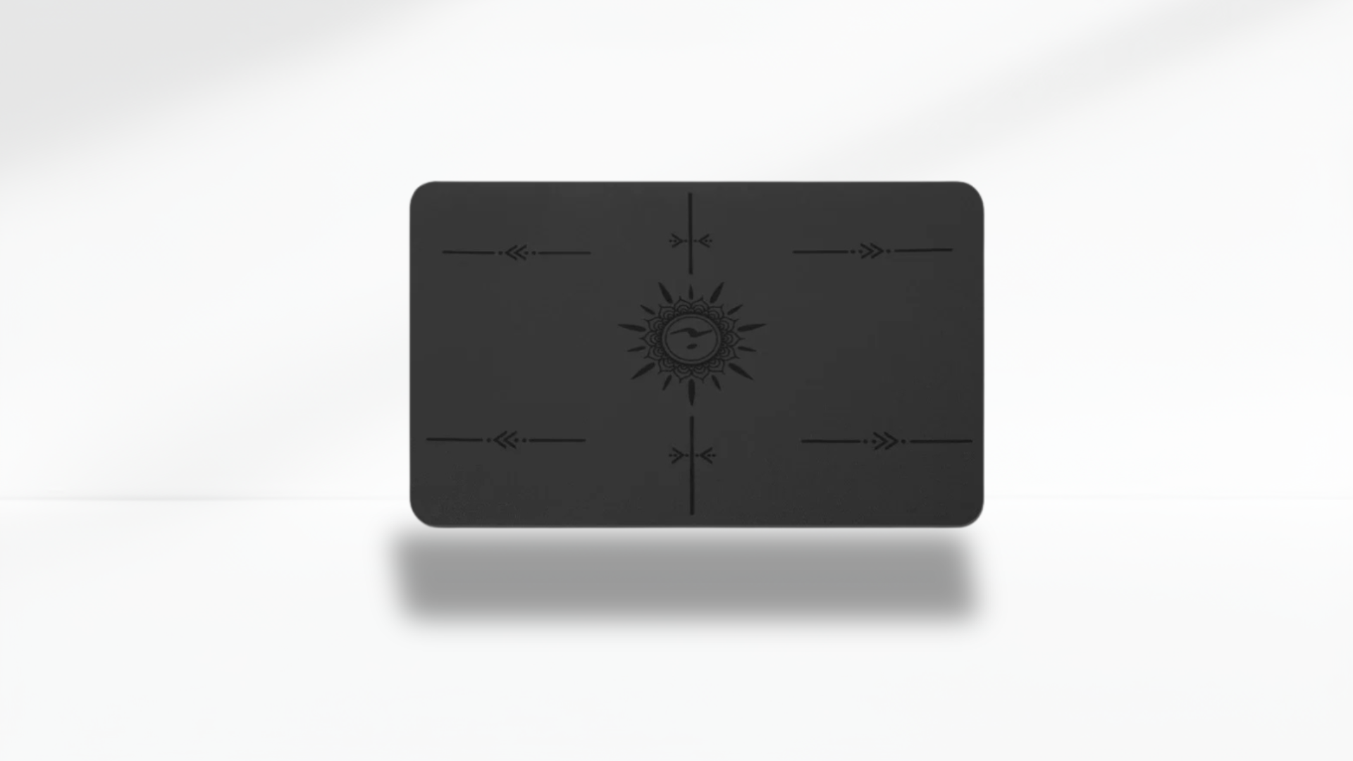 Front view of a black mini flat support yoga mat with alignment markers on a clean white background.