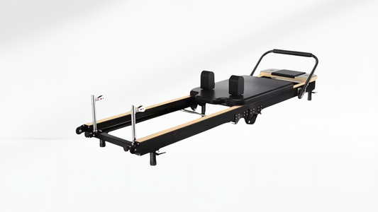 black Pilates Reformer – Rebounder & 6-Level Resistance on a white background