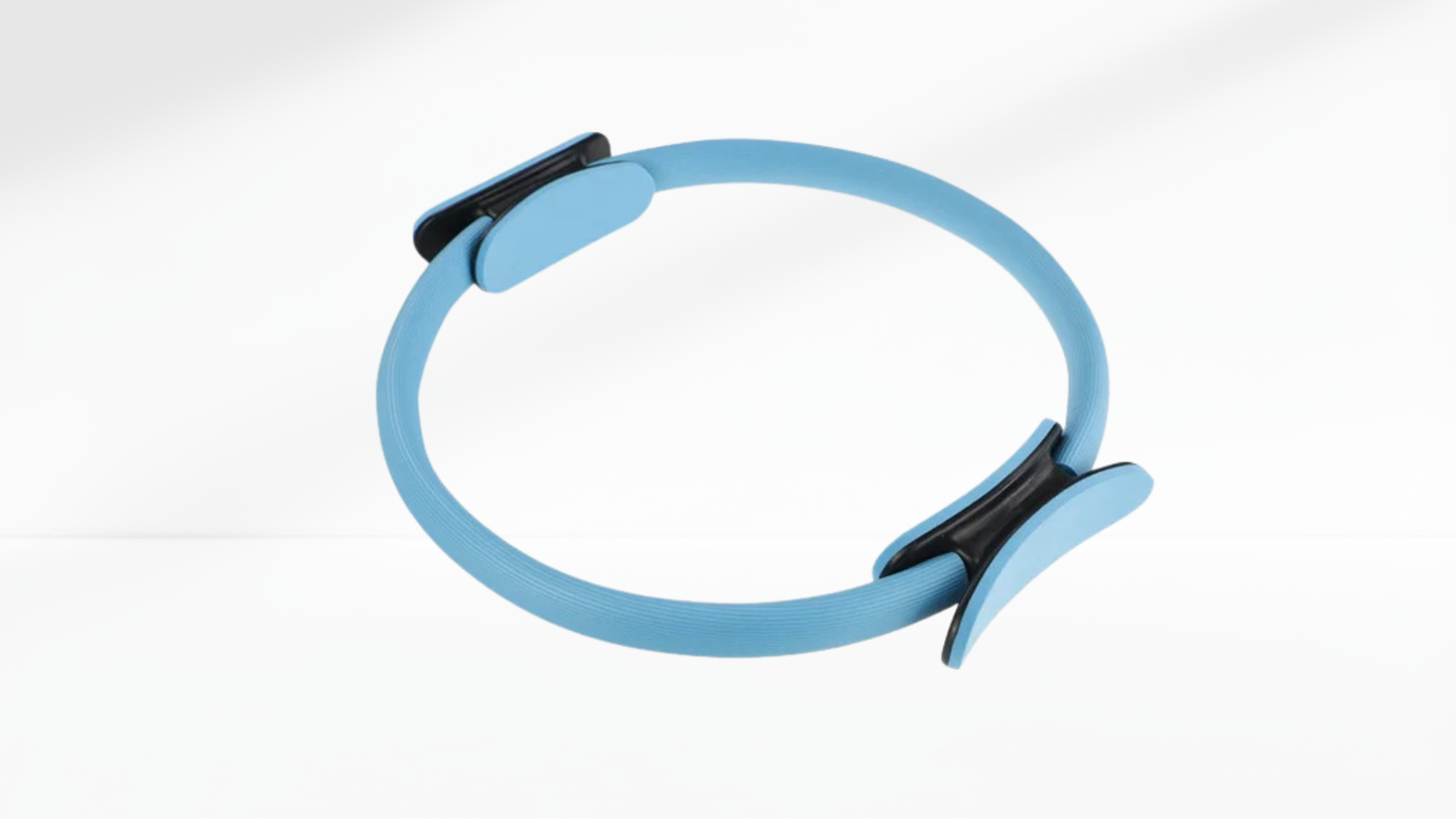 blue pilates ring with a black clip on a white background