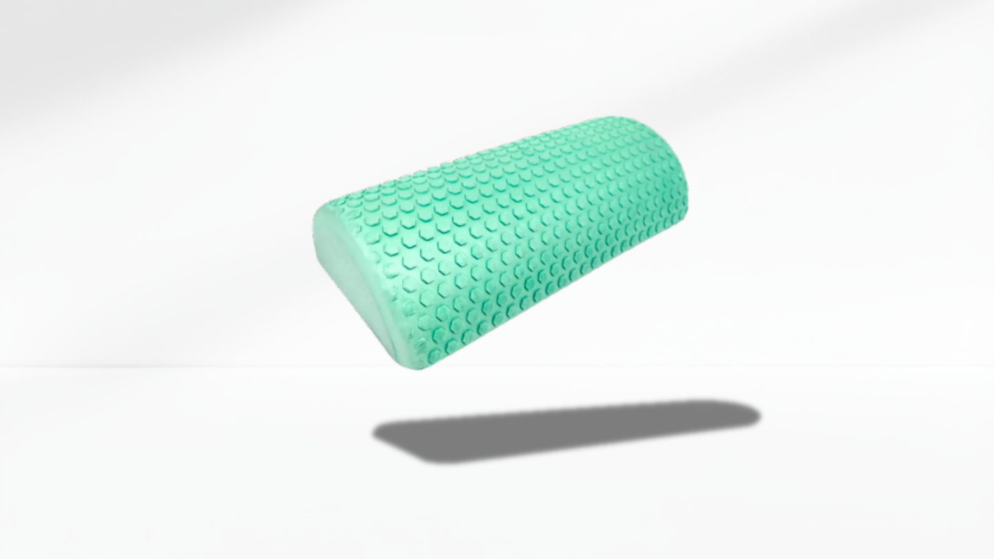 Green textured half foam roller shown in an angled floating view with soft shadow, highlighting its curved shape and massage surface.