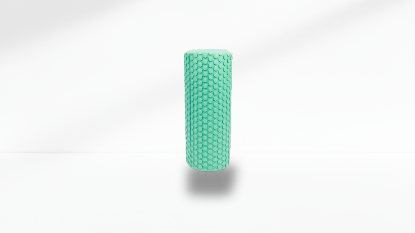 Front view of a green textured half foam roller standing upright on a white background with soft shadow, showing the full massage texture.