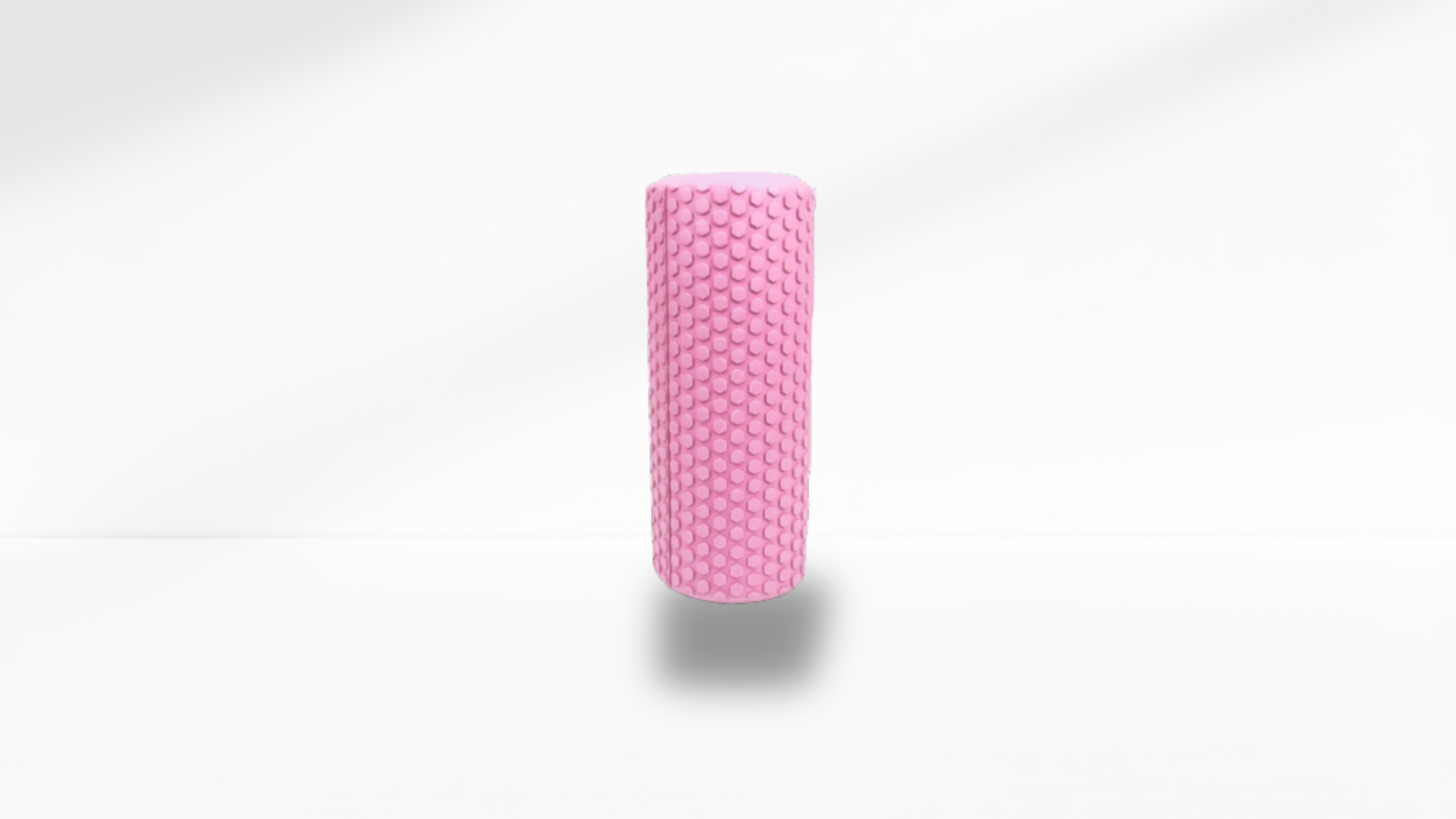 Front view of a pink textured half foam roller standing upright on a white background with soft shadow, showing the full massage texture.