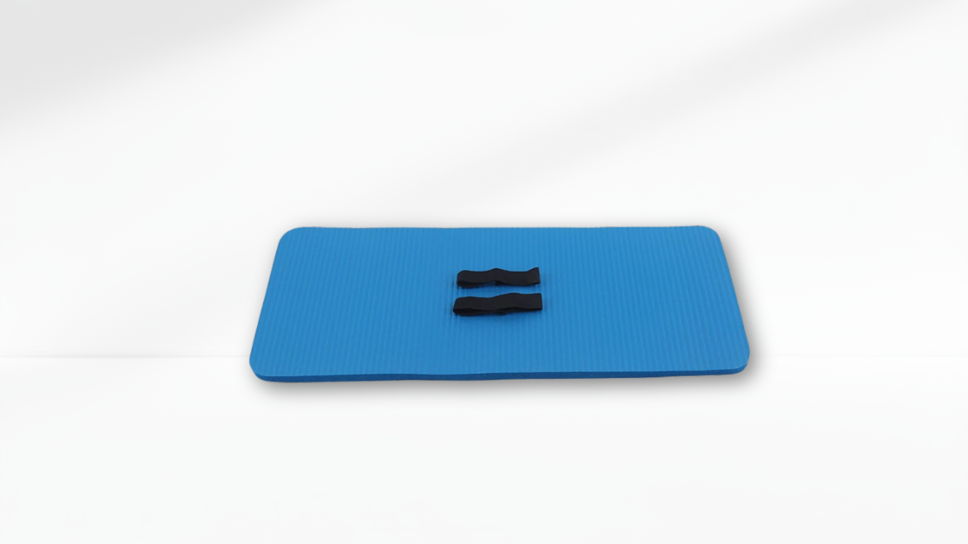 light Blue exercise mat with two black handles on a white background